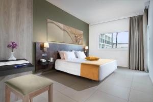 Postel nebo postele na pokoji v ubytování Mayfair Hotel + 36 fotografií