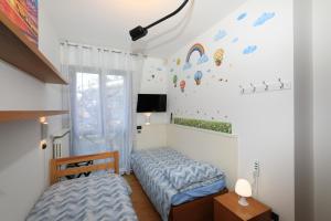 a bedroom with a bed and a window at Central Luxury Apt w Garage Happy Home Bergamo in Bergamo