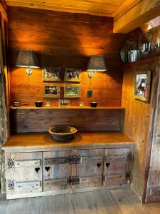 a wooden counter in a room with two lamps at Sycamore Alpine Retreat - 5 mins from the slopes in Planvillard