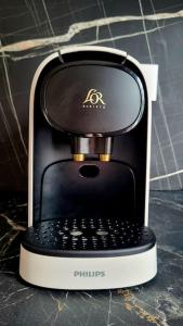 a coffee maker sitting on top of a counter at Le Premium, entre Paris & Disney avec Parking Gratuit in Noisy-le-Grand +6 photos