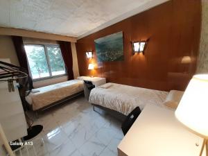 Ένα ή περισσότερα κρεβάτια σε δωμάτιο στο Sci LS