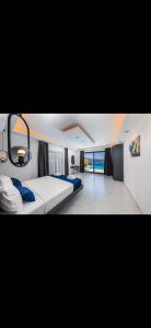 a large bedroom with two beds and a large window at Villa simurg in Kas +20 photos