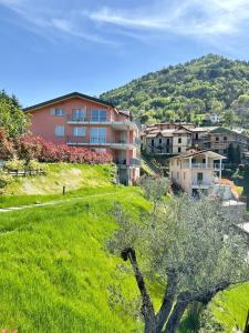 a view of a town with a hill in the background at Bellagio Dreams,Luxury Apartment in Bellagio
