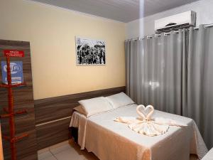Postel nebo postele na pokoji v ubytování Pousada Cangaço