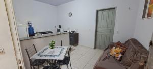 a living room with a couch and a table at Flat Jm 02 in Parauapebas