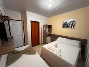 Postel nebo postele na pokoji v ubytování Pousada Cangaço
