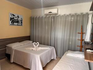 Postel nebo postele na pokoji v ubytování Pousada Cangaço