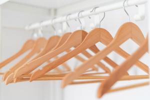a bunch of wooden hearts hanging on a rack at Centro apartamento 2-D in Huelva