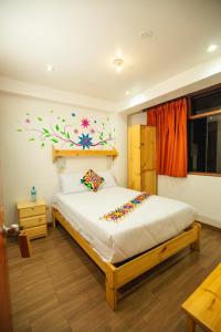 Postel nebo postele na pokoji v ubytování Hotel Ruta Amazónica Machupicchu