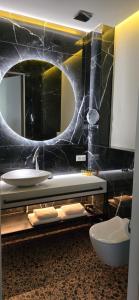 a bathroom with a sink and a mirror at Villa Szyprów in Jastarnia +98 photos