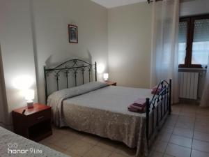 Postel nebo postele na pokoji v ubytování Villa Biancofiore