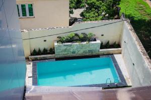 an overhead view of a swimming pool on a building at Grand Palmac Hotel in Abuja