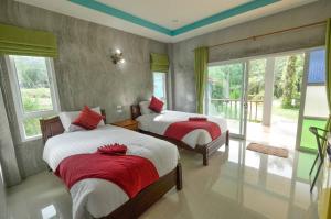 Postel nebo postele na pokoji v ubytování Tum Mai Kaew Lanta Resort + 37 fotografií