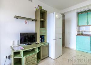 Kuchnia lub aneks kuchenny w obiekcie Inftour Amatista 9 Apartamento