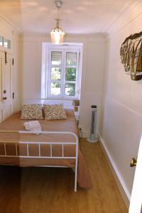 a bedroom with a bed and a window at Casa da Ti Cristina in Pomares