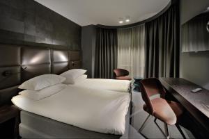 Voodi või voodid majutusasutuse Amsterdam Forest Hotel toas
