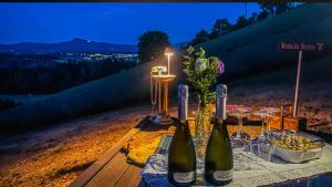 a table with two bottles of wine on it at La lavanda di Poppi-mini appartamento in Poppi
