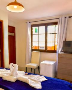 Un ou plusieurs lits dans un hébergement de l'établissement Inn House Santa Teresa