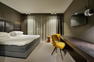 Postel nebo postele na pokoji v ubytování Amsterdam Forest Hotel