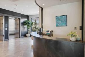 an office with a reception desk and a lobby at One Riverfront Condo 204 by East West Hospitality in Avon +32 photos