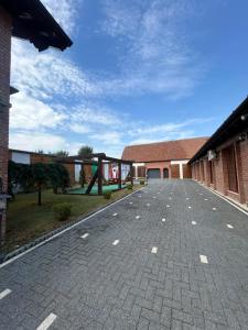 an empty parking lot in front of a building at Transilvania Guesthouse in Miercurea Sibiului