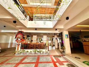 a lobby with a church with aasteryasteryasteryasteryasteryasteryasteryasteryastery at Papierus Pensionne in Kalibo