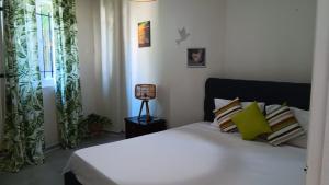Voodi või voodid majutusasutuse Grand Baie View Appart toas