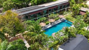 an overhead view of a hotel with a pool and trees at The Nidhra Boutique Resort in Ban Tai