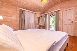 Postel nebo postele na pokoji v ubytování Alicra Hotel Çıralı