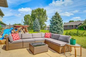 a patio with a couch and a table at Family-Friendly Unit 8 Mi to Appleton Downtown! in Appleton