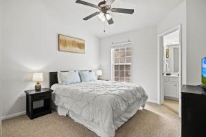 a bedroom with a bed and a ceiling fan at 40 Lighthouse Rd. Unit 3-402 in Lake Ozark +36 photos