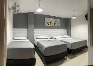Postel nebo postele na pokoji v ubytování Hotel Lesus