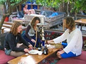a group of three women sitting at a table at Bayrams Tree Houses in Olympos +32 photos