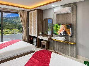 Postel nebo postele na pokoji v ubytování En Hotel Sapa