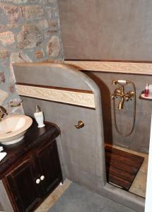 a bathroom with a shower and a sink at Guest Stone Houses in Aidona in Aïdón