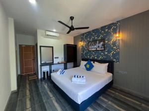 Letto o letti in una camera di Kuda Vilu, Mathiveri, Maldives