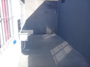 an empty room with a hallway with a window at Departamento Interno in Azul