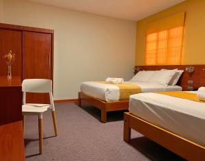 Cama o camas de una habitación en Hoteles Paraiso CHICLAYO
