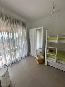 En eller flere senge i et værelse på Villa Aurora