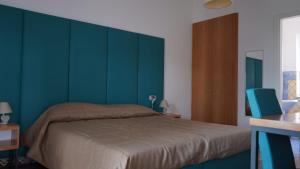 Voodi või voodid majutusasutuse Hotel L'Isola toas