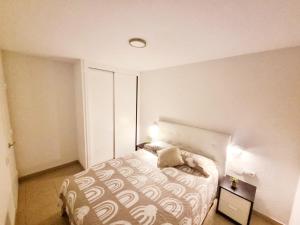 a small bedroom with a bed in a room at Apartamento Oroval Residencial Anaga in Santa Cruz de Tenerife