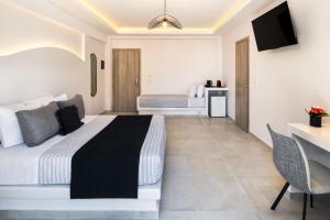Santorinn Suites Fira客房内的一张或多张床位