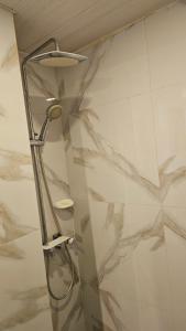 a shower in a bathroom with marble walls at Lydia's House in Kaputian +92 photos