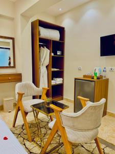 TV a/nebo společenská místnost v ubytování House Pyramids hotel