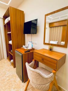 TV a/nebo společenská místnost v ubytování House Pyramids hotel