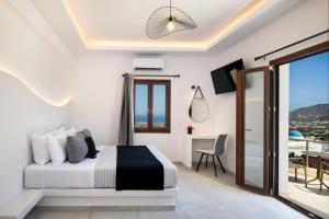 Santorinn Suites Fira客房内的一张或多张床位