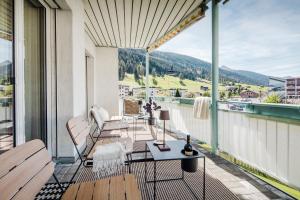 a balcony with a view of a mountain at Tinzenblick in Davos