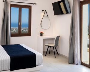 Santorinn Suites Fira客房内的一张或多张床位