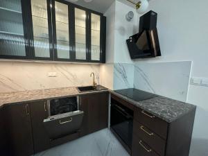 Η κουζίνα ή μικρή κουζίνα στο Narodowa Apartment