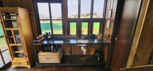 a bathroom with a sink and a window at Recanto AlceNegro in Miguel Pereira